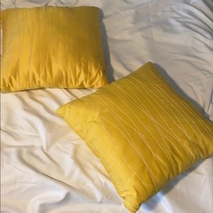 2 yellow decorative pillows